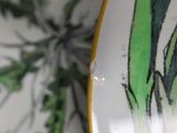 a close up of a plate with a flower on it