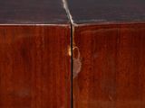 a brown wooden cabinet with two doors and a brown handle