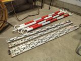 four red and white poles sitting next to each other on the floor