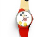 mickey mouse watch on a white surface with a red band