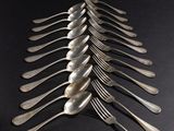 a lot of spoons that are sitting on a table