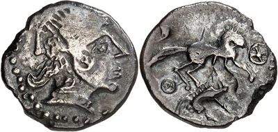a silver coin with an image of a man riding a horse