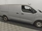 a picture of a silver van parked in a garage