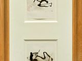 two framed photographs of a cat and a dog in a wood frame