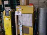 a yellow machine that is sitting in a room