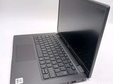 a black laptop with a black keyboard on a white surface