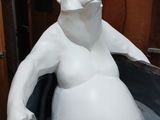 a statue of a polar bear that is sitting in a tub