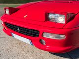a red sports car parked on the side of the road