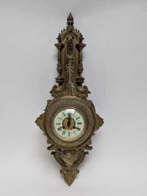 a clock hanging on the wall in the room