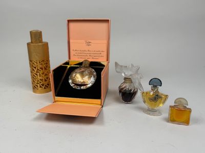 a small box with a perfume bottle and a perfume bottle in it