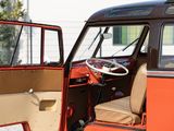 an orange and tan van parked in a parking lot