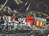 a plate with a picture of a horse drawn carriage on it