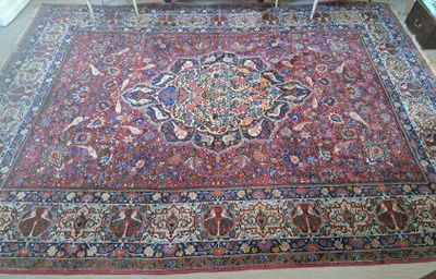 a large oriental rug on the floor in a living room