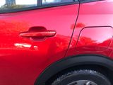 a close up of a red car with a black rim