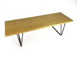 an image of a wooden bench with hairpin legs on a white background