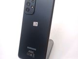 the back of a black samsung galaxy s20 with a camera attached to it