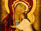 a painting of a woman holding a baby in her arms