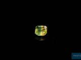 a green and yellow diamond on a black background