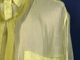 a man wearing a yellow shirt and a yellow tie