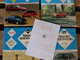 four books on a wooden table with papers and a car in front of them