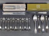 an assortment of silverware including forks, spoons, and knives