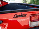 a close up of the back end of a red sports car