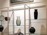 many vases on display in a glass case