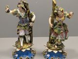 pair of porcelain figurines of a man and a woman