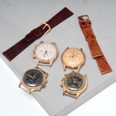 several different types of watches are displayed in a display case