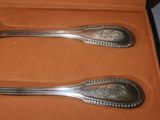 two spoons that are sitting in a box