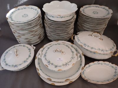 a lot of plates and bowls sitting on a table