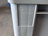 a close up of a trash can on the floor