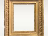an antique gold frame with a decorative pattern on the edges