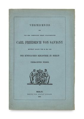 a blue book with a black and white image of a coat of arms