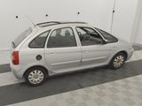 a picture of a silver car parked in a garage