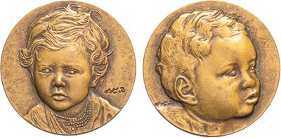 a gold coin with a baby ' s face on it