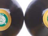 four black and gold vinyl records lined up against a white background