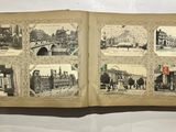 an open book with pictures of buildings and people on it