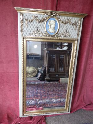 a large mirror with a picture of a man on it