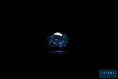 a close up of a blue diamond on a black background