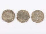 three silver coins, one of which is a roman coin and the other of which is a roman coin