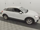 a white audi suv parked in a garage with a checkered floor