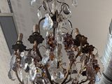 a chandelier hanging from the ceiling in a room