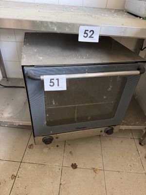 two ovens that are sitting on a counter
