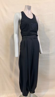 the mannequin is wearing a black jumpsuit and a black top