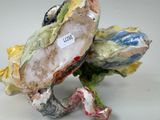 a figurine of a turtle with a tag on it ' s back