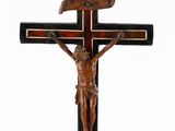 an antique wooden crucifix with a wooden cross on a stand