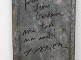 a sign on the wall that has writing on it