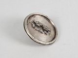 an image of a silver button with the word love written on it