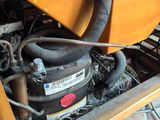 a close up view of a small engine in a wooden box